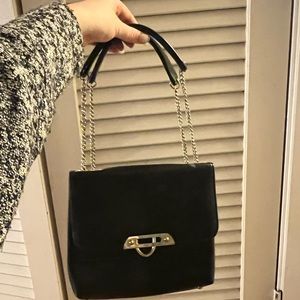 Black vintage purse with the adjustable strap